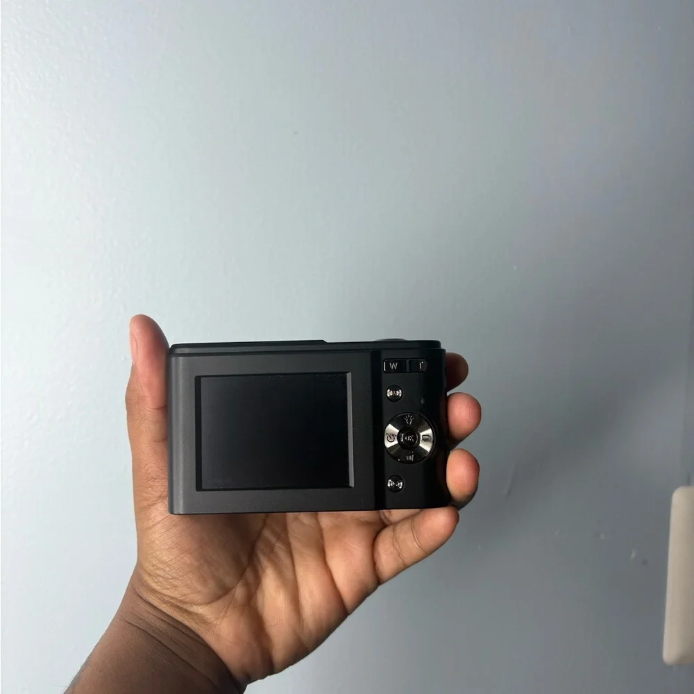 Compact Black Camera with Silver Accents